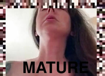 Mature slut with big tits rides cock