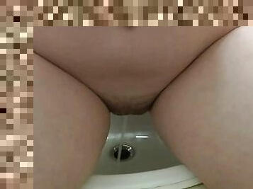 girl peeing in the sink