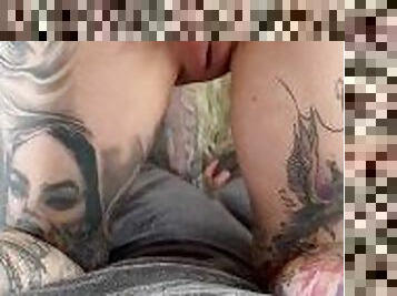 Inked girl fingers herself anal