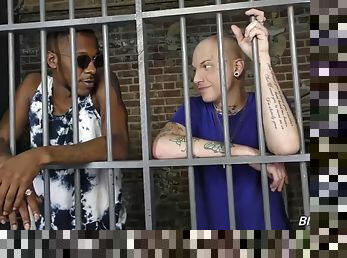 Tattooed white guy rides a black cock in prison
